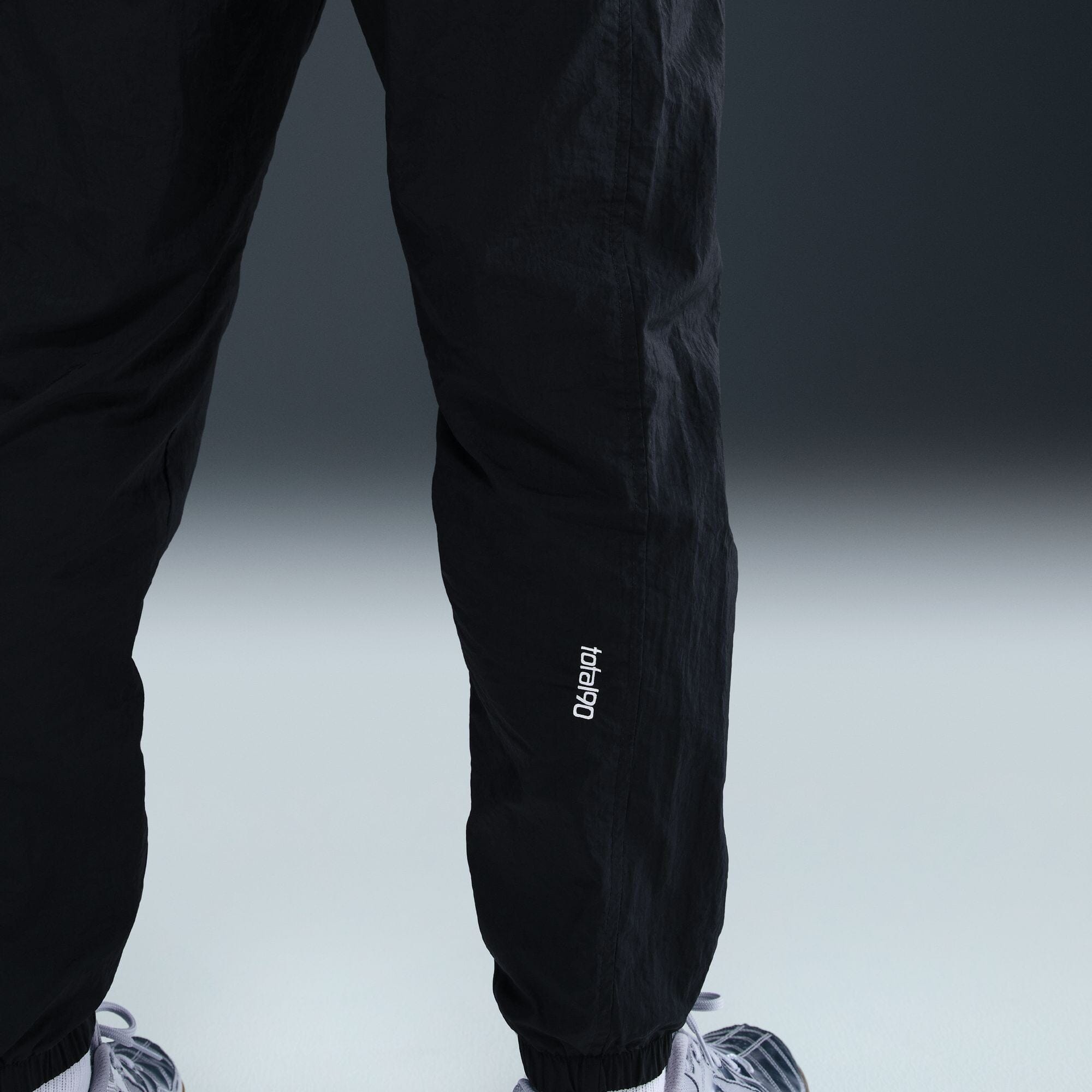 Paris Saint-Germain Men's Total 90 Woven Track Pants (HQ9762-010) Apparel Nike