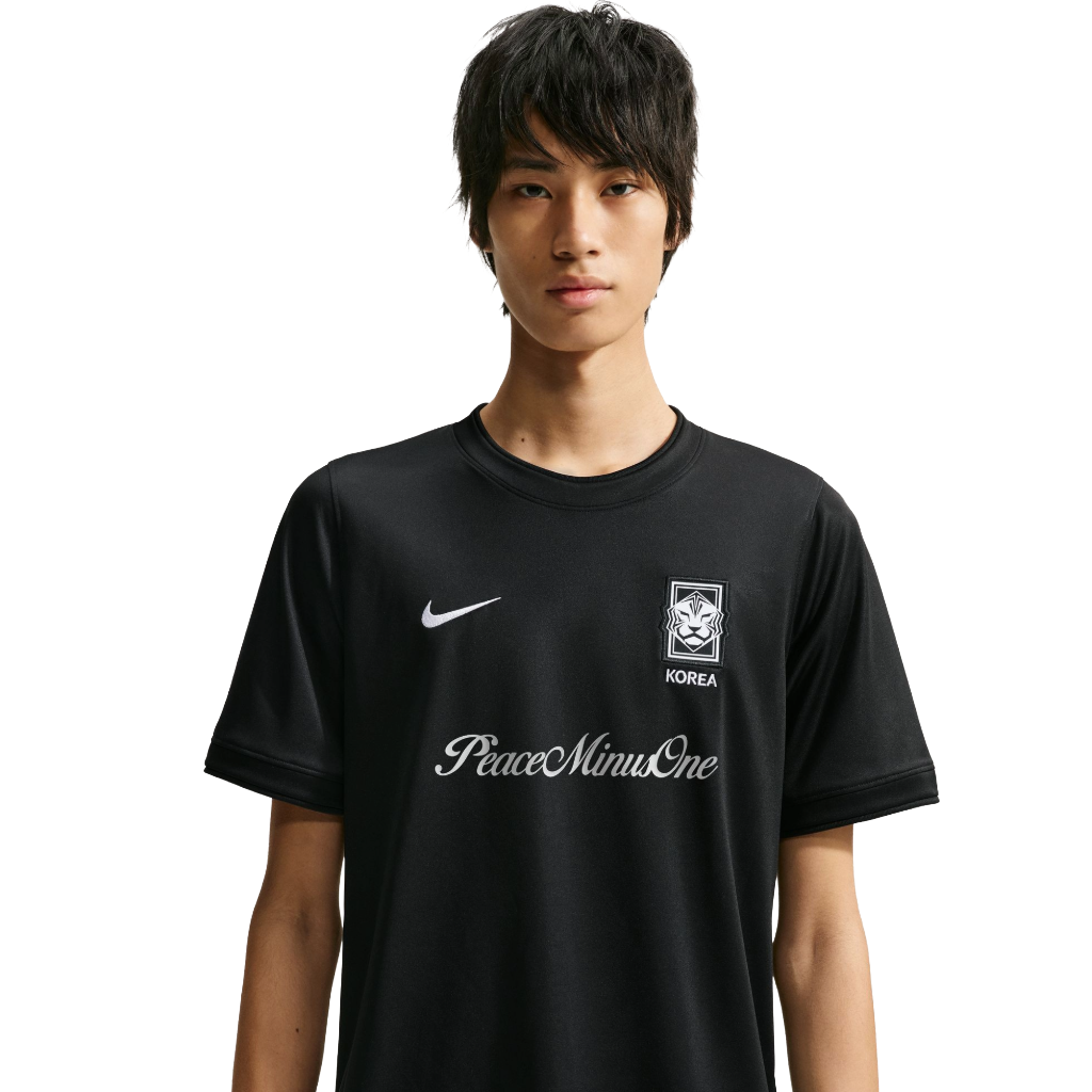 South Korea x PEACEMINUSONE Unmatched Pre-Match shirt back view showing large daisy logo with red and blue petal edges and integrated Swoosh